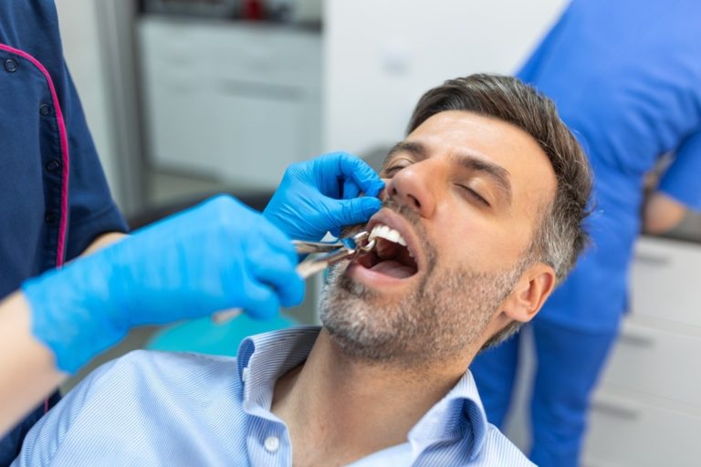 Dentist explaining tooth extraction options
